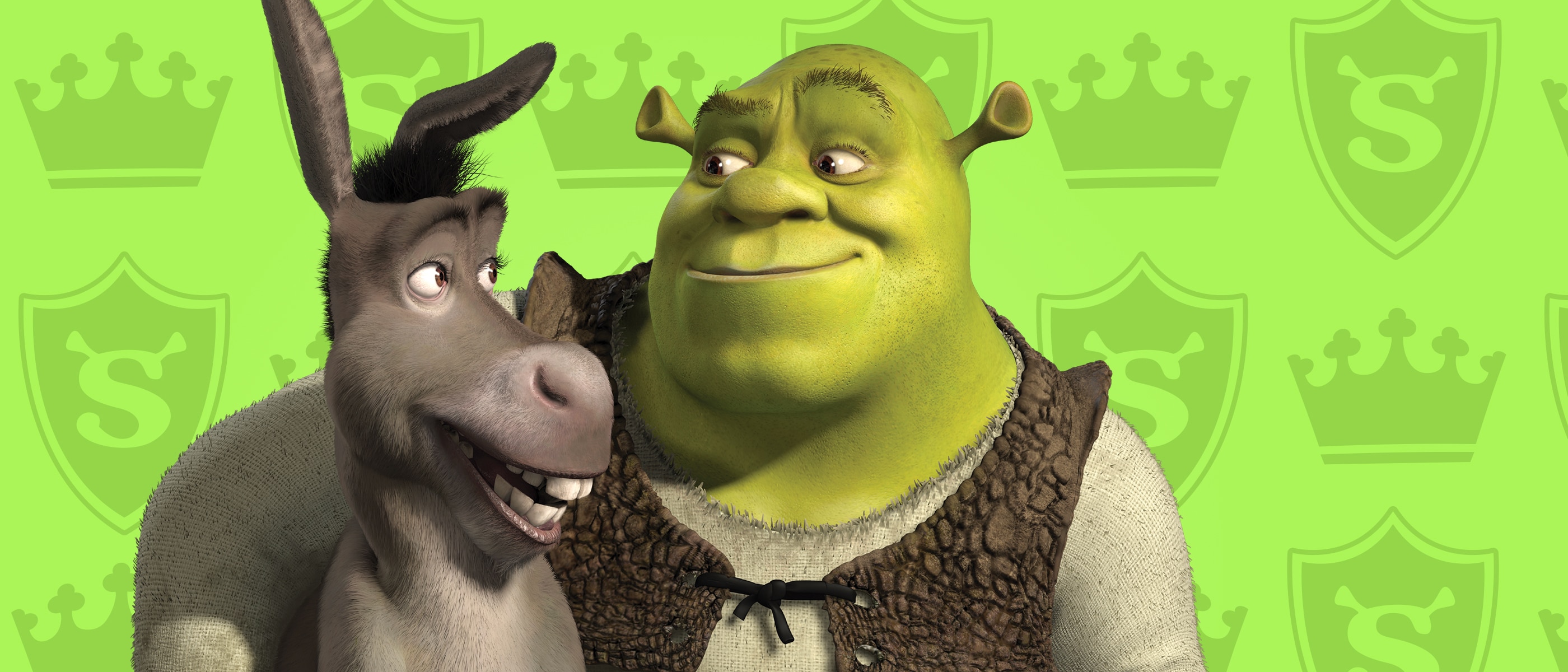 Shrek smiling at Donkey, against a green background with crown-shaped icons. 