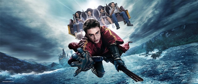Four kids on the Harry Potter Forbidden Journey ride with Harry Potter flying on a broom.